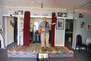 MUST GO ON: Tim Burns began learning to play the guitar when he was four-years old. His love of music is what inspired him to open Picayune’s Sold Gold Theater.  Photo by Cassandra Favre