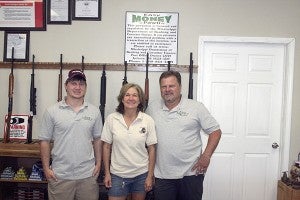 EASY MONEY: From left are Jacob, Michele and Derek Whitfield, who run the family owned business, Easy Money Pawn, located on Miss. 43 S. Photo by Jeremy Pittari