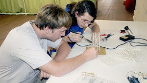 LEARNING SKILLS: From left Picayune Make members Leland Thomas and Luc Lagard work on an LED cube. Photo by Jeremy Pittari