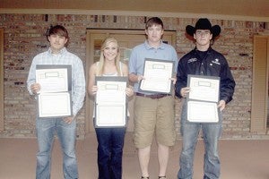 STATE CHAMPS: Four of the five Poplarville residents that took home state titles in the Mississippi High School Rodeo competition were honored by the Poplarville School District. From left are Clay Brown, McKinsy Harris, Chase Graves and Brandon McBride. Not pictured is Marcus Theriot, who does not attend the school district. Photo by Jeremy Pittari
