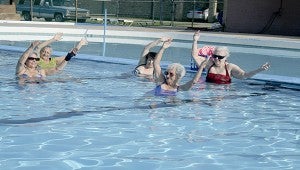 LOW IMPACT: Water exercise instructor Juanita Gex, center, conducts a session at the Cornerstone in Picayune with a class of senior citizens. The class is offered twice a week on Monday and Wednesday. Photo by Jeremy Pittari