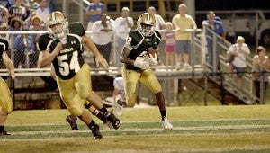 WINNING TEAM: Poplarville running back Keith Dotson runs the ball for yardage during Friday’s game against Stone County. Poplarville won 43-42. Photo by Cassandra Favre