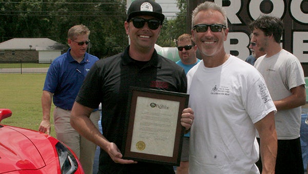 Mayor Ed Pinero presented HotRod Magazine Editor Jeff Dahlin with a proclamation from the City of Picayune. 