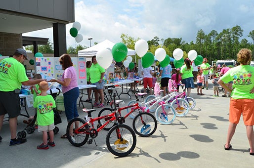 SAFETY FAIR: Highland Community Hospital gave away bikes and helmets to families during last year’s safety fair. Submitted photo.