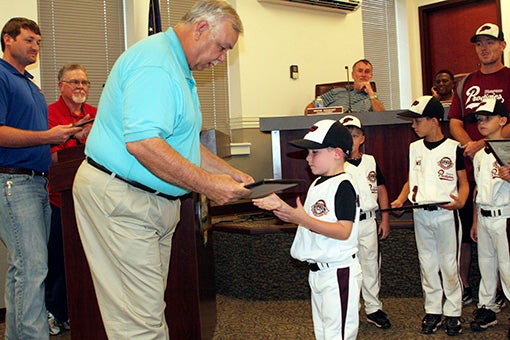 RECOGNIZING TALENT: Pictured, Harvey Miller, director of operations, awarding a certificate to a player from the Picayune Prodigies. Each player received a certification from the city, honoring them for their great season. Photo by Ashley Collins. 