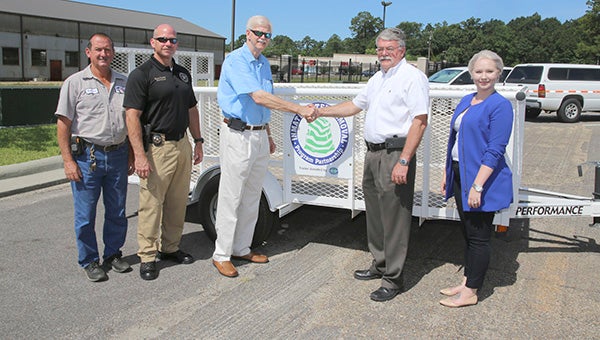 LITTER PROGRAM: Representatives from MDOT and Keep Mississippi Beautiful presented the Pearl River County Sheriff’s Department with a trailer on July 1. Pictured from left is MDOT Maintenance Operations Superintendent Raymond Necaise, Pearl River County Sheriff’s Department Chief Deputy Shane Tucker, Southern District Transportation Commissioner Tom King, Pearl River County Sheriff David Allison and MDOT Litter Prevention Coordinator District 6 Jessica Warrington.  Photo courtesy of MDOT 