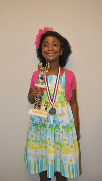 third runner-up: Seven-year-old Neely Jackson tied for third runner-up in the Pre-Teen America Program.  Photo by Cassandra Favre
