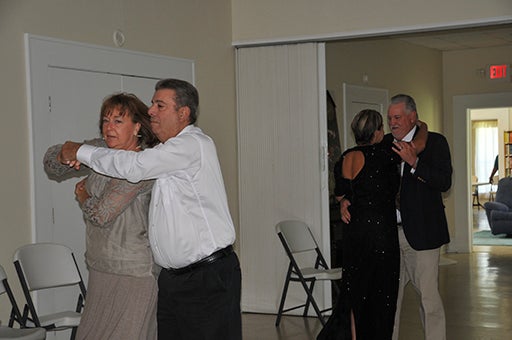 DANCE To Impress: Couples expertly twirl around the dance floor during the senior prom.