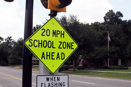 ROADWAY SAFETY: This road sign on Goodyear Boulevard warns drivers they’re approaching a school zone. Photo by Ashley Collins.