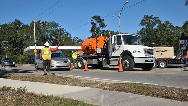 Jesse Wright | Picayune Item wastewater repairs: A repair crew works on the wastewater lines on Beech Street Thursday afternoon. The PRCUA board got an update on the repairs Thursday and the board of directors also discussed raising water rates. 