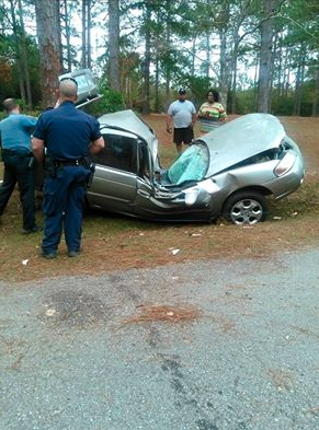CAR CRUSHED: The Nissan struck a tree Tuesday morning. Submitted photo.