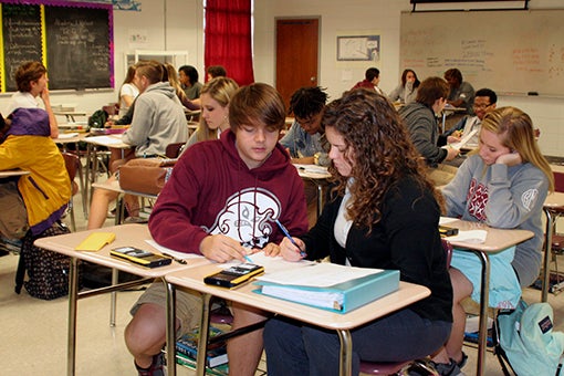 SAFE PLACE FOR LEARNING: Students in Algebra II work on a group assignment at Picayune Memorial High School. School resource officers in the Picayune School District work throughout the year to build relationships with students in order to keep the classrooms safe. Photo by Ashley Collins.