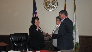 Cassandra Favre | Picayune Item Oath of Office: From left, Jane O’Neal takes the oath of office as Poplarville Mayor Brad Necaise swears her in as city clerk of Poplarville. O’Neal’s aunt Linda O’Neal Hickman held the Bible. 