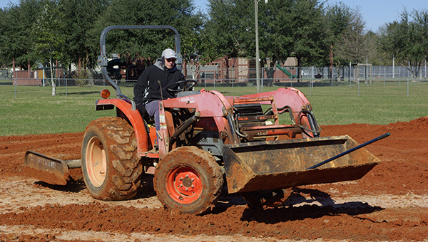 Jesse Wright | Picayune Item prep work: Jerry Todd with the Picayune Parks Department works on a softball field at Friendship Park.