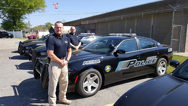 BRAND NEW: Picayune Police Chief Bryan Dawsey and Assistant Chief Jeremy Magri pose in front of some of the new patrol vehicles. In all, nine new vehicles will be on the road. Photo by Jeremy Pittari