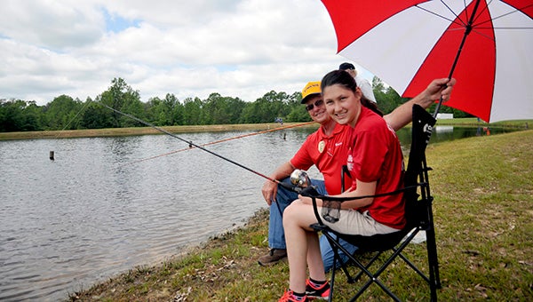 CATCHING FISH: Pearl River Central High School student Natalie Harberson caught fish with her grandfather, Doug Mooney at the Kiwanis Club of Greater Picayune Area’s Fishing Rodeo.  Photo by Cassandra Favre
