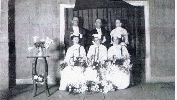FIRST IN CLASS: Picayune Memorial High School’s first graduating class of 1912. Pictured from front left are Lena Tate, valedictorian, Mary Ryals and Inez Harrington. Pictured from back left are Principal W.I. Thames, Rev. Herrington and Ida Brockman.  Photo submitted.  