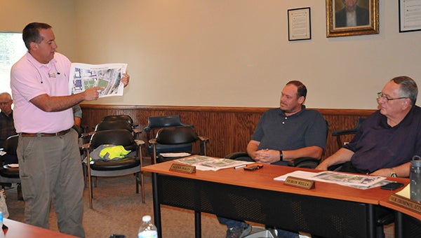 DESIGN PHASE: City engineer Jason Lamb, of Hattiesburg's Walker and Associates, presents the first proposed design of the Railroad Park and Green Space in downtown Poplarville to the Poplarville Board of Aldermen.  Photo by Cassandra Favre