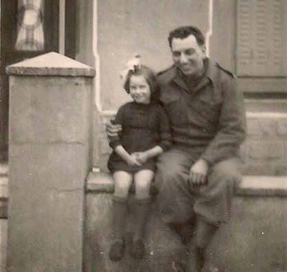 From left, Denise Robert sits with Carl Lazarone during WWII in Neuchef, France on March 12, 1945.  Photo submitted
