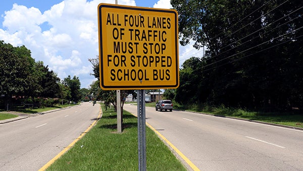 ENDANGERED SIGNS: Signs such as this on along Main Street in Picayune will soon be removed now that a change to a law concerning passing a stopped school bus took effect at the beginning of this month.  Photo by Jeremy Pittari