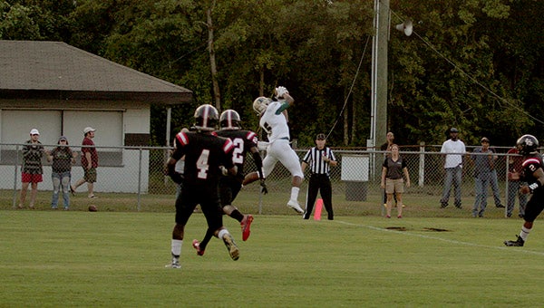 Austin Bolton catches a touchdown during last Friday's game against Lumberton.