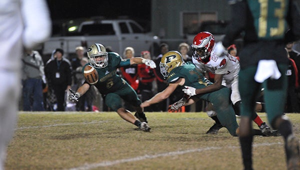 Poplarville’s lead receiver Tyson Holston (8) attempts to catch a tipped pass in recent action.