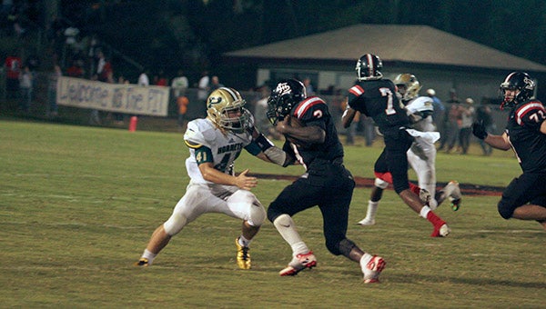 Senior middle linebacker Hunter Callahan takes down a talented Lumberton running back in the Hornets’ 44-12 victory on Sept. 2.