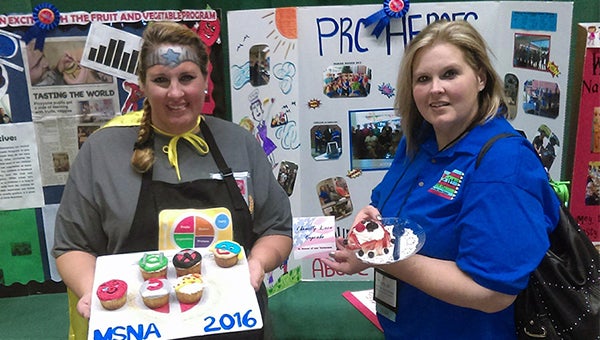Danica Barber (left) and Tina Farrell (right) received first prize in the storyboard and cupcake competitions, respectively, at the annual Mississippi School Nutrition Association Conference in Tupelo. Submitted photo 
