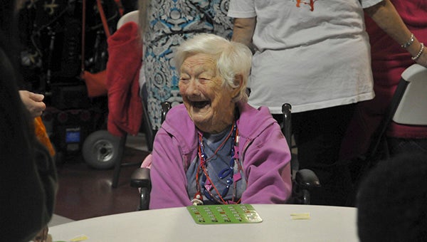 A participant of The Arc's Christmas bingo event reacts as she wins a round of bingo. Photos by Taylor Welsh.