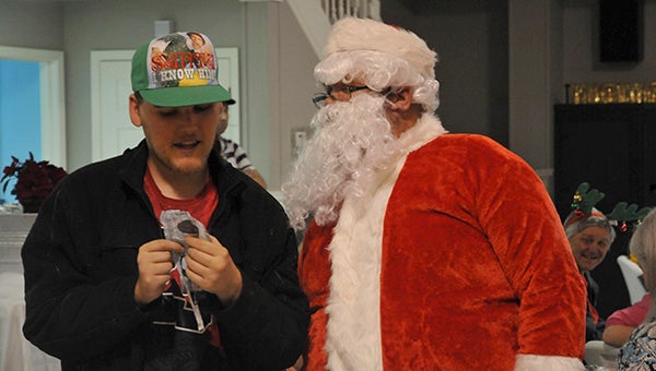 A bingo participant shows Santa exactly what he wants for Christmas.