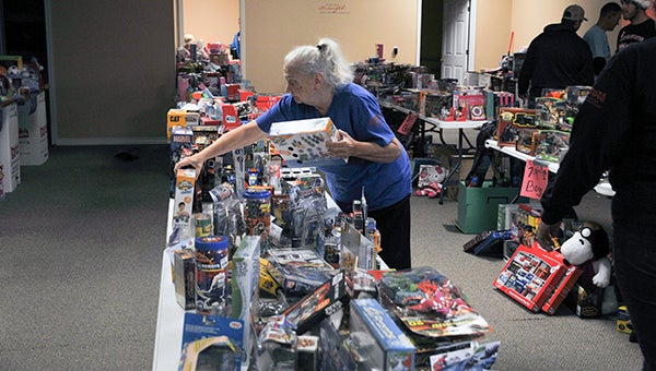 The volunteers neatly organized hundreds of toys for the Toys for Tots distribution.