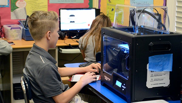 Students in Alicia Verweij's gifted class are incorporating computer coding skills and a new 3-D printer to enhance their real world learning.  Photo by Julia Arenstam 