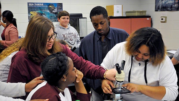 SCIENCE IN THE CLASSROOM: Students at a Picayune school learn how to use a microscope. NASA is offering several classes for educators to help them increase the variety of their STEM instruction. Photo by Taylor Welsh