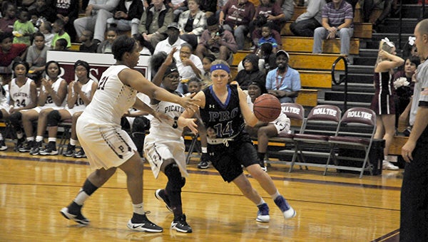 crossover: Lady Blue Devil Harlee David, 14, led her team with 16 points and five rebounds Friday night against Picayune. Photo by Taylor Welsh