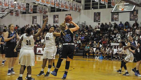 Kayla Ryan, 15, squares up to take a shot in previous action against Picayune. Ryan had a season-high 14 points against FCAHS on Tuesday. Photo by Taylor Welsh