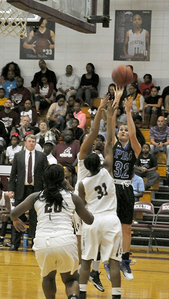 Lakyn Spence sinks a midrange shot while being double-teamed in recent action. Photo by Taylor Welsh