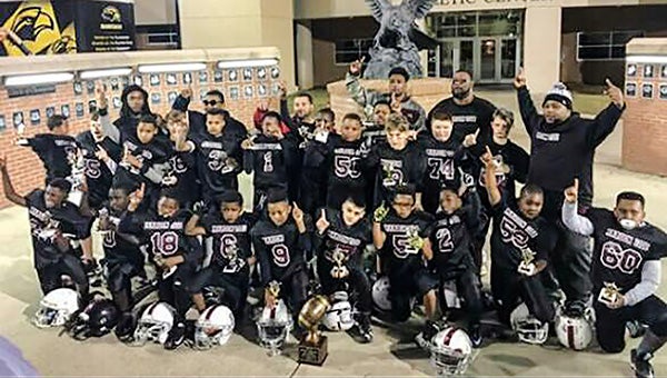 The midget Picayune Maroon Tide celebrate its first state championship in front of University of Southern Mississippi’s M. M. Roberts Football Stadium on Dec. 10. Submitted Photo