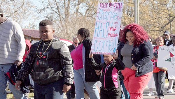 I HAD A DREAM: Participants of the Martin Luther King, Jr. march/parade last year celebrate the historic words of MLK and the positive impact it has on the world today. 
