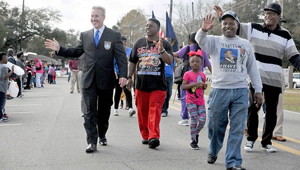 UNIFIED: City leaders, like Picayune Mayor Ed Pinero, pictured left, marched with community members in celebration of Martin Luther King Jr.’s birthday on Monday. Photo by Taylor Welsh