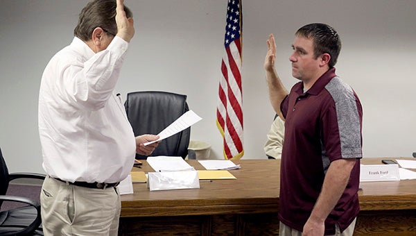 OATH OF OFFICE: At right, Jake Smith is sworn into the Picayune School Board of Trustees during Tuesday’s meeting. He is filling a seat that has been vacant since February of last year. In February of this year another seat will be left vacant until an election is held in November.  Photo by Jeremy Pittari