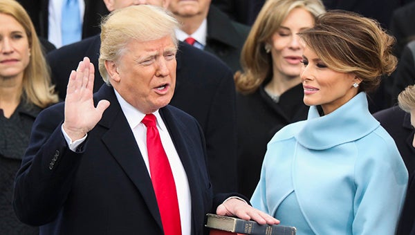 Donald Trump is sworn in as the 45th president of the United States as Melania Trump looks on during the 58th Presidential Inauguration at the U.S. Capitol in Washington, Friday, Jan. 20, 2017. (AP Photo/Andrew Harnik)