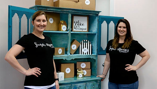 Sisters-in-law Colbi Moeller, left, and Katy Smith, right, opened their newly joined bakery Sugar Mama's this week after the BAKE Project co-op decided to branch out.  Photo by Julia Arenstam 