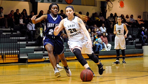 Elizabeth Hughes paces past a defender as she makes her way to the basket. Photo by Taylor Welsh