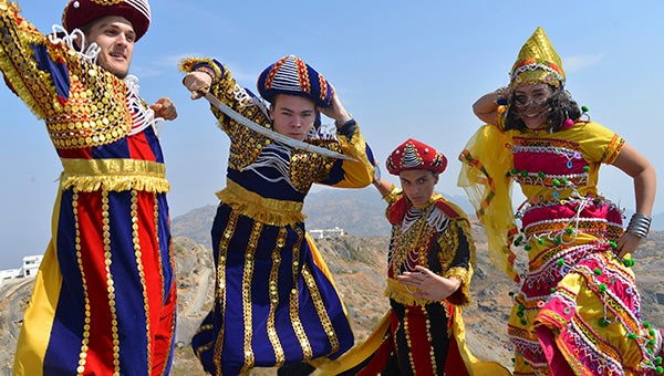 Bradley Booth, pictured in the middle, and a couple of his exchange friends dressed in traditional garb on top of Mount Abu.
