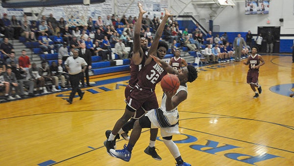 Louis Reece takes on two Aggie defenders in the Blue Devils victory Friday night. Photo by Taylor Welsh