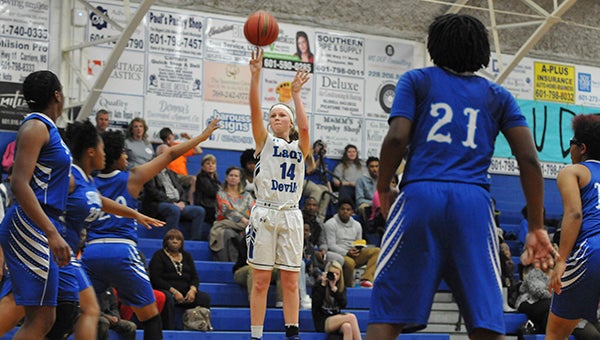 Harlee Davis, 14, got the Lady Devils started with a 3-pointer in the first quarter.  Photo by Taylor Welsh