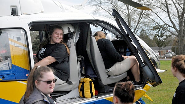 Pearl River Central High School students explore the Rescue 7 helicopter during the rescue crew's visit Monday afternoon. Photo by Taylor Welsh