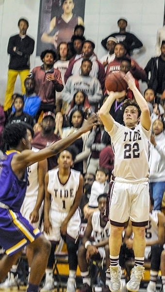 Clay Knight, 22, sinks the game-winning 3-pointer as time expires during the Maroon Tide’s matchup against the Tigers Tuesday night. Photo by Taylor Welsh
