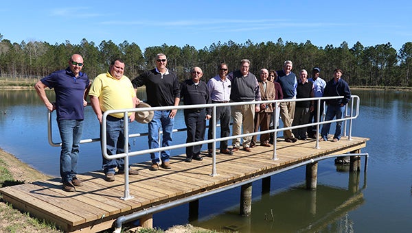 GRAND OPENING: Pearl River County Utility Authority Board of Trustees members were joined by staff and contractors at the completed Wildwood wastewater lagoon.  Photo by Jeremy Pittari